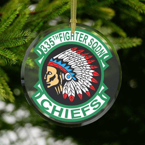 Customizable glass ornament featuring the 335th Fighter Squadron Chiefs Patch with beveled edges, printed on one side with a diameter of 3.5" (88.9mm) and a gold-colored ribbon for hanging. Clear glass material, with a slightly transparent design.